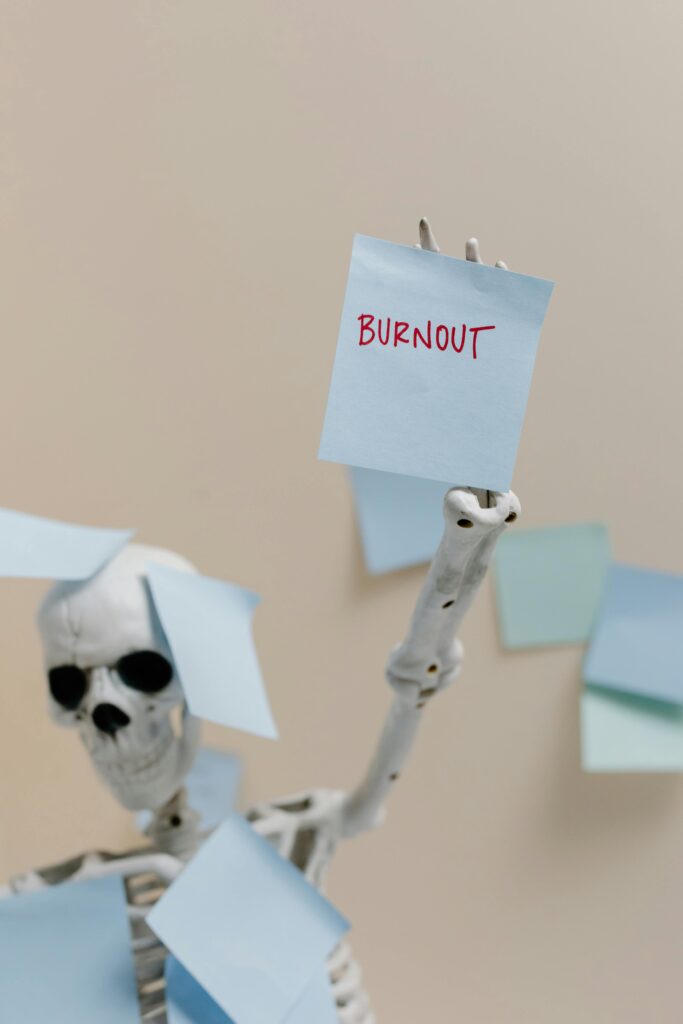 A skeleton surrounded by sticky notes, emphasizing the concept of burnout and exhaustion.